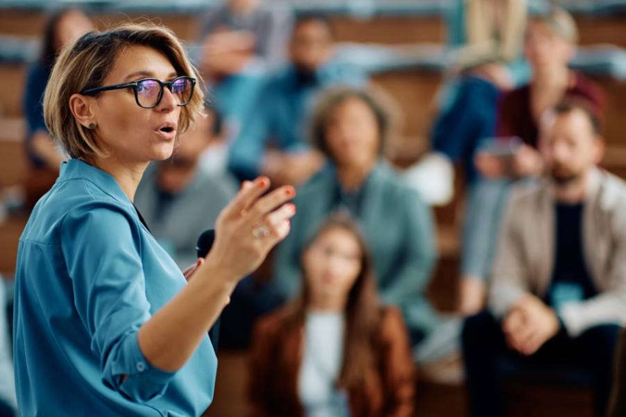 A woman delivering a lecture